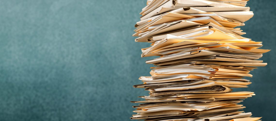 Stack file folders with documents on background